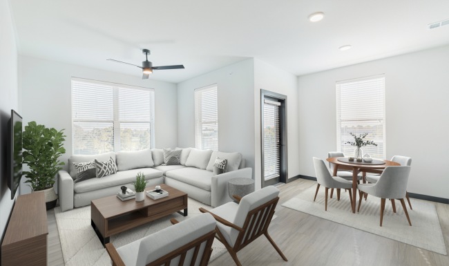 furnished open-concept dining and living area with hardwood flooring